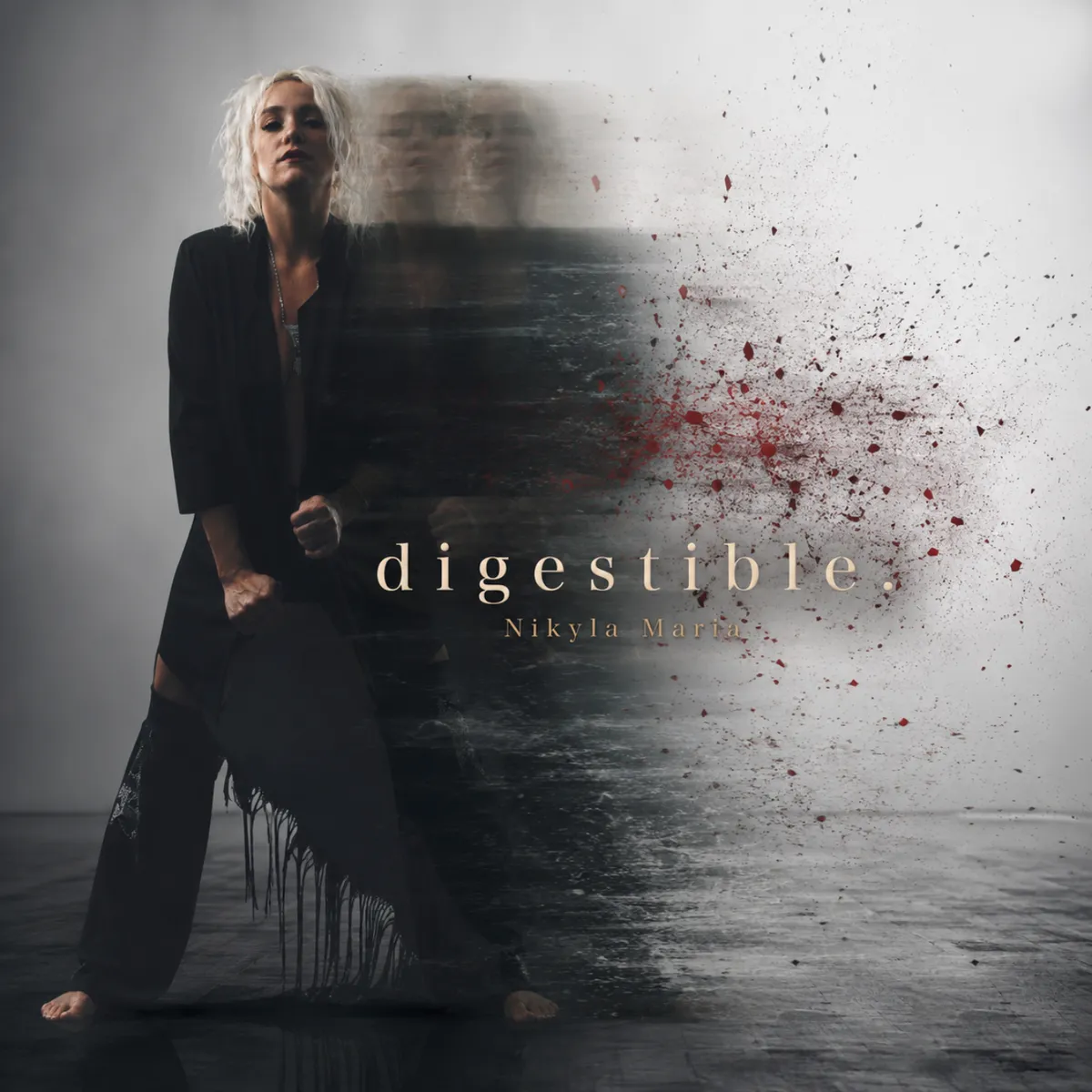 Cover art for digestible.: Nikyla stands barefoot in black, fists clenched, while a blurred copy of her body streaks to the right and dissolves into flecks of red.