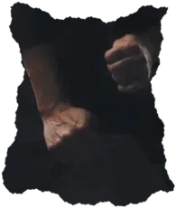 Two clenched hands against black cloth.