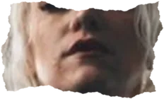 A woman's mouth and chin, pale hair falling around it.